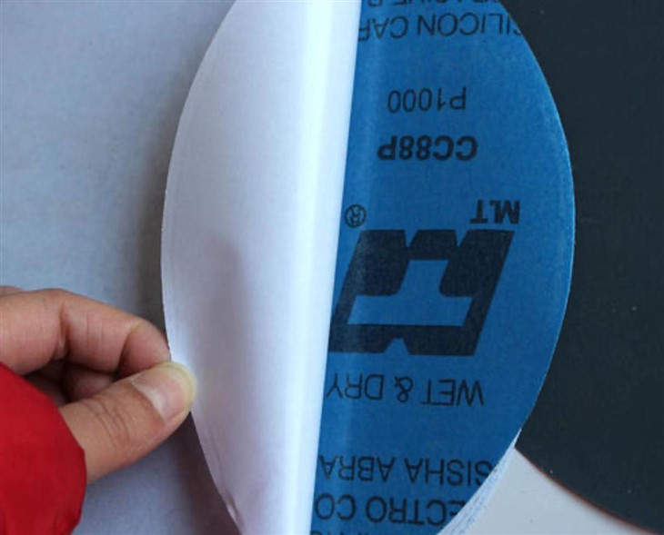 Adhesive backed sanding discs